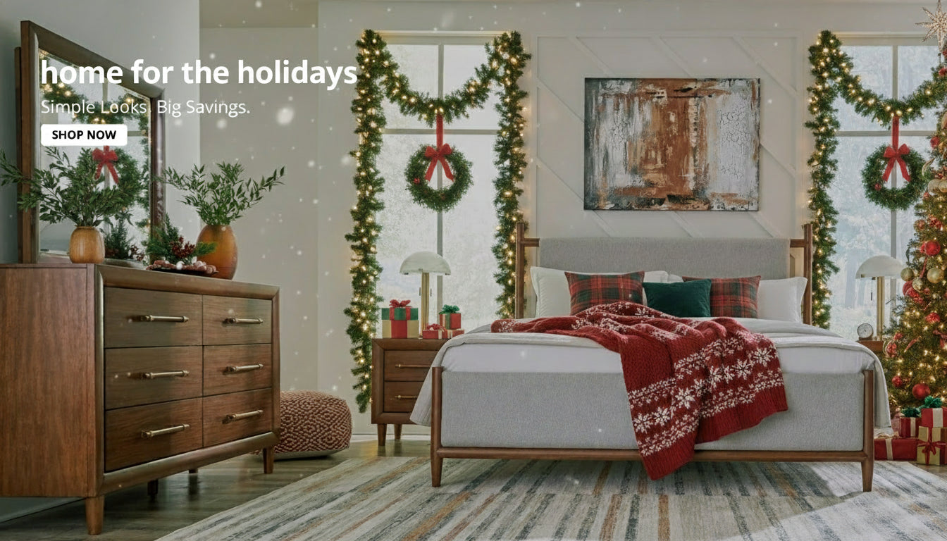 Modern bedroom with wooden dresser, bed, and abstract art on the wall.